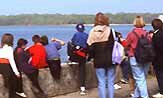 Picture of a group of adults and children looking at harbour views