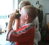 Picture of schoolchildren looking through binoculars